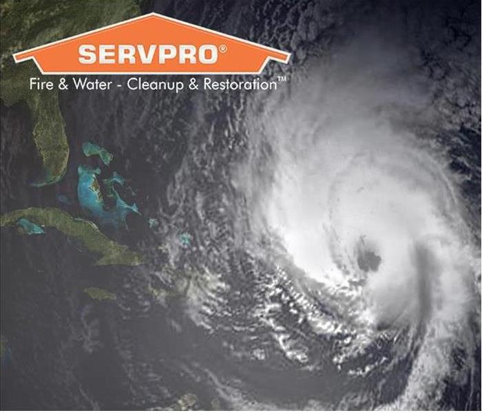 SERVPRO name logo and a hurricane approaching FL.